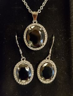 "Stunning Onyx Black Cubic Zirconia Crystal Halo Necklace/Earring Set, See Video! 10x12mm Sterling Silver Crystal Halo Pendant, 18\" Sterling Chain. Chain Length Options Acailable By Messaging Seller At Time Of Purchase. Matching Earrings With 8x10mm CZ, Ear Wire Closure. Gift Box Included. Great Gift!" Silver Oval Jewelry Sets With Matching Earrings, Formal Sterling Silver Jewelry Sets With Oval Shape, Halo Necklace, Halo Pendant, Cz Necklace, Silver Crystal, Necklace Earring Set, Ear Wire, Matching Earrings