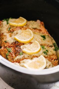 chicken breast with lemons and parsley in a slow cooker