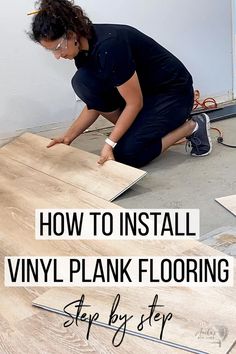 a woman kneeling on the floor installing vinyl planks