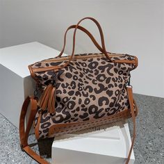 Large Capacity Leopard Print Women's Shoulder Bag Lady Shopping Tote Handbag Fashion Rivet Female Big Crossbody Bags with Tassel Lining Material: POLYESTER Main Material: nylon Occasion: Versatile Exterior: none Model Number: female shoulder bags Closure Type: zipper Decoration: LOCK Hardness: SOFT Trendy Travel Bags With Tassels, Trendy Tassel Travel Bags, Trendy Tassel Satchel Shoulder Bag, Travel Shoulder Bag With Tassels And Double Handle, Travel Satchel With Tassels, Double Handle Shoulder Bag With Tassels For Travel, Travel Tote Satchel With Tassels, Big Crossbody Bag, Lady Shopping