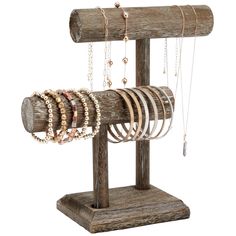 a wooden jewelry rack with bracelets and rings hanging from it's sides on a white background