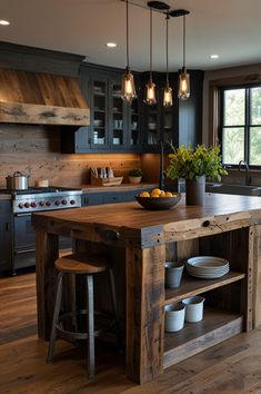 a large kitchen island in the middle of a room with two stools next to it