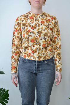 Fifties "Jantzen" Baroque Floral Cardigan. Button Closure in Front. Unlined. Made in USA No Content Label Tag Size 40 Excellent Vintage Condition - Tiny Marks All Measurements Taken Flat Pit to Pit-20" Waist-17.5" Shoulder to Shoulder-15.5" Sleeve Length-22.5" Shoulder to Hem-20.5" All Sales Are Final. We have taken the time to note all size measurements and the condition of each piece so please look over all the information of the garment you are considering purchasing. Please note that all ite Retro Button-up Top For Winter, Vintage Floral Print Spring Cardigan, Vintage Floral Print Cardigan For Winter, Vintage Floral Print Cardigan For Fall, Vintage Floral Print Winter Cardigan, Vintage Floral Print Winter Tops, Vintage Winter Floral Print Tops, Vintage Winter Floral Cardigan, Fall Vintage Floral Print Cardigan