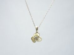 Gold flower necklace- simple dainty necklaceThree petal flower charm hangs on a dainty 14K gold filled chain.  Simple and dainty jewelry, a great everyday necklace.>>>measurements<< Dainty 14k Gold Charm Necklace With Flower Charm, Delicate Necklace With Flower Charm, Dainty Everyday Flower Charm Necklace, Delicate Gold Charm Necklace With Flower, Delicate Gold Charm Necklace With Flower Design, Delicate Everyday Charm Necklaces, Tiny Delicate Pendant Charm Necklace, Dainty Yellow Gold Flower Pendant Charm Necklace, Delicate Necklace With Flower Charm In 14k Gold Filled