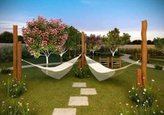 there are two hammocks in the yard with trees and flowers on each side