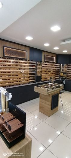 an empty store filled with lots of wooden items on display in front of rows of shelves