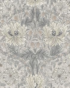 an intricately designed wallpaper with large flowers and leaves on the side, in grey and white