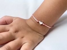 The First Day of School is a big, scary step for some little ones. Make the first day a little less hard with these adorable Mommy and Me heart bracelets. Perfect for the first day of preschool, kindergarten, first grade, daycare, or camp. You will receive two bracelets - a larger size for mom (or dad) and a smaller size for your little one. Bracelets are easily adjustable to fit any wrist size. Bracelets are made out of nylon satin silk cord and a silver metal heart. Bracelet card can be person Handmade Heart-shaped Friendship Bracelets For Birthday, Adjustable Pink Bracelets For Playtime, Adjustable Pink Bracelet For Playtime, Pink Adjustable Bracelet For Playtime, Playful Adjustable Friendship Bracelets For Gifts, Playful Adjustable Friendship Bracelets As Gift, Cute Adjustable Charm Bracelet With Heart Charm, Adjustable Birthday Bracelet With Heart Charm, Playful Bracelets With Heart Charm For Gift