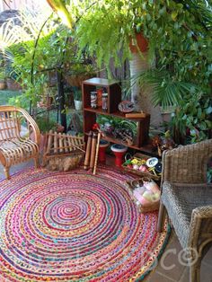 an outdoor area with wicker furniture and potted plants