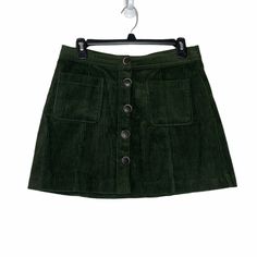 Nwot. Zara Green Corduroy Min Skirt With Two Front Pockets And Print Button Clouser. Ref 7901/282. Waist 15” Flat, Length 14.5.” Size M. Fall Mini Skort With Button Closure, Zara Mini Skirt With Pockets For Fall, Green Cotton Mini Skirt For Fall, Fall Green Skort With Pockets, Winter Corduroy Skirt With Button Closure, Fall Corduroy Button-up Bottoms, Green Mini Skirt With Button Closure, Zara Skirt With Pockets For Fall, Trendy Corduroy Skirt With Buttons