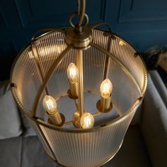 a chandelier hanging from the ceiling in a living room