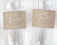 two baby shower products in clear plastic bottles