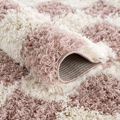 the carpet is made up of many different colors and sizes, including pinks and browns