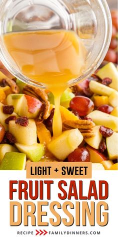 fruit salad dressing is being poured into a glass bowl with apples, grapes and pecans