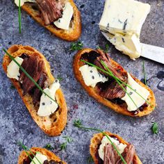 some food is laying on a table with cheese and other things to eat in it