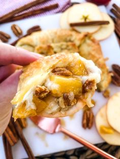 cinnamon apple baked brie in puff pastry with pecans and cinnamon on the side