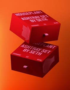 two red boxes with white lettering are stacked on top of each other in front of an orange background