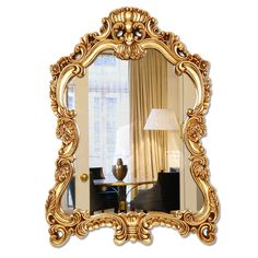 a mirror that is on the wall with a lamp in front of it and curtains behind it