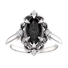 a black and white diamond ring on top of a white background with the center stone surrounded by diamonds