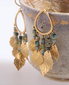 These stunning Natural Turquoise Earrings feature a gold leaf design with beaded details and a teardrop shape, embodying a unique Bohemian style perfect for adding a touch of elegance to any outfit. Crafted with care, these earrings combine the natural beauty of turquoise with the richness of gold, making them an ideal choice for both special occasions and daily wear. The intricate design ensures they stand out as a statement piece. Whether you're dressing up for an event or adding a bit of flair to your everyday look, these earrings offer versatility and timeless style. They also make a thoughtful and unique gift for someone special. ** Jewelry Care Guide ** Please keep it away from chemicals, store it in a dry place, avoid dropping, and seal it when not in use.  Alloy: Avoid contact with Turquoise Earrings Gold, Leaf Earrings Gold, Earrings Beads, Gold Leaf Earrings, Earrings Teardrop, Turquoise Boho, Beads Earrings, Boho Stil, Natural Turquoise