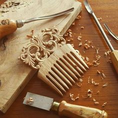 a wooden cutting board topped with lots of wood shaving tools