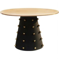 a black and white table with gold studs on the top, against a white background