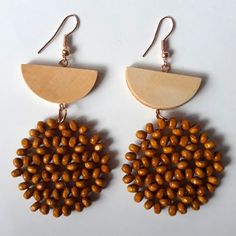 Very Light Weight Two Shades Of Light Brown Intricately Woven With Clear Thread Check Out My Other Listings For More Light Weight Wood Earrings Brown Round Bead Earrings For The Beach, Bohemian Brown Beaded Round Earrings, Brown Round Beads Earrings For Beach, Brown Round Beaded Earrings For Beach, Brown Beaded Earrings For Beach, Brown Dangle Beaded Earrings For Summer, Handmade Brown Beaded Earrings For Summer, Handmade Brown Beaded Summer Earrings, Brown Beaded Drop Earrings For Beach