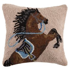 a decorative pillow with a horse on it's back and blue rope around its neck