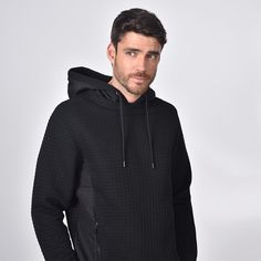 Model in black, quilted hoodie with side zip-pockets and a drawstring hood. Quilted Hoodie, Black Hooded Sweatshirt, Men's Activewear, Cut Sweatshirts, Designer Menswear, Black Quilt, Italian Fabric, Hooded Pullover, Athletic Wear