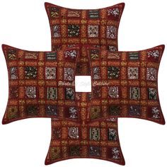 three red and brown pillows with different designs on the front, one is made out of fabric