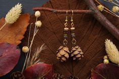 Nature jewelry lovers watch out! The forest jewelry collection is expanded with new pine cone earrings. These beautiful wooden earrings are studded with real pine cones, collected in the Black Forest in southern Germany, and will delight any hippie or boho lover. The handmade wooden jewelry pieces are a perfect gift for the nature jewelry lover. Each earring has been carefully crafted from natural materials, making them one-of-a-kind. Wear a piece of the forest on your ears with a pair of fir earrings and show your love for nature. These ethnic earrings are versatile enough to be worn with a variety of outfits. Explore our collection of fir earrings and wooden jewelry and find the piece of jewelry that enhances your personality. Treat yourself or a loved one to something special that is gu Pine Cone Earrings, Forest Jewelry, Southern Germany, Diy Jewelry Earrings, Jewelry Wood, Earrings Nature, Earrings Wood, Nature Earrings, Hippie Earrings