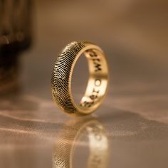 a fingerprint ring sitting on top of a table