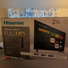 an advertisement for the new television has been put up in front of it's box