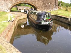 there is a boat going down the canal