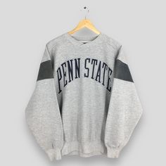 Vintage 90s Penn State Nittany Lions Football Sweatshirt Large Penn State Printed Spell Out Crewneck PSU Pennsylvania University Sweater L Size On Tag :- Size L Manual Measurement :- WIDTH (armpit to armpit) :- 23.5" inches LENGTH (shoulder to end of garment) :- 28" inches WEIGH :- 0.70 kg Condition :- Good Condition. No holes and stains. - Colors Might Be Different Due To Lighting. - All items are VINTAGE which show some signs of wear and tear. FEDEX EXPRESS = 3-6 business day arrived Please pr Pennsylvania University, Penn State Sweatshirt, University Sweater, Lions Football, University Of Pennsylvania, Nittany Lion, Football Sweatshirt, Fedex Express, Penn State