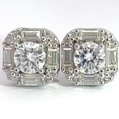 Beautiful new style Moissanite stud earrings customized with flawless round and baguette Moissanite stones. This is a must buy for somebody looking for something new that nobody has, and let's not forget about the unbelievable shine coming off both the centre stone and the beautiful flawless baguettes surrounding it. https://www.youtube.com/@MoissaniteAngel Classic Diamond White Baguette Diamond Earrings, Classic Cluster Earrings With Baguette Diamonds, Silver Moissanite Baguette Cut Earrings, Dazzling Baguette Cut Diamond Earrings, Cubic Zirconia Baguette Diamond Earrings For Anniversary, Gia Certified Round Cut Diamond Cluster Earrings, Classic Baguette Diamond Cluster Earrings For Anniversary, Gia Certified White Diamond Baguette Cut Earrings, Diamond White Baguette Cut Halo Earrings