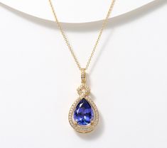 Elevate your accessory game with Pure Tanzanite by Jeff Moseley. This stunning pear-shaped, heat treated tanzanite and diamond pendant on a cable link chain, all set in 18K gold, is sure to capture your heart -- and the attention of jewelry afficionados wherever you go. Get ready for the compliments. From Pure Tanzanite by Jeff Moseley. Pendent Set, Tanzanite Necklace, Diamond Pendant, Link Chain, Pear Shaped, Pear, 18k Gold