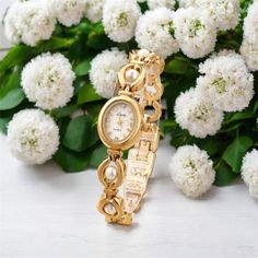 Description: Discover elegance with our personalized vintage gold pearl women's watch, a perfect gift for her. This exquisite timepiece blends timeless vintage design with modern sophistication. Crafted from durable stainless steel in a radiant gold finish, it features luminous pearls that add a touch of luxury to any outfit. Customization Options: - Personalization:Add your custom name in your choice of font design. - Color: Elegant gold hue. - Size:Adjustable strap with included tool for perfe Vintage Gold Stainless Steel Watch, Elegant Gold Stainless Steel Watch, Elegant Gold Watch For Gift, Elegant Gold Watches For Anniversary, Elegant Stainless Steel Wedding Watch, Gold Metal Watches For Anniversary, Gold Metal Watches For Wedding, Elegant Stainless Steel Watches As Gifts, Elegant Gold Watches For Wedding