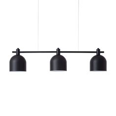 three black lights hanging from a ceiling fixture