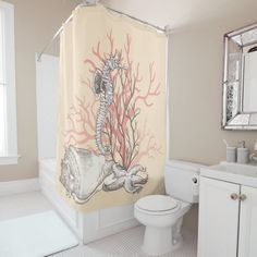 a bathroom with a shower curtain that has a seahorse on it