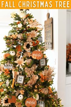 a small christmas tree decorated with fall decorations and pumpkins is featured in this post