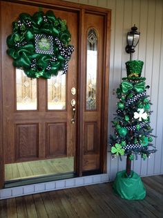 the front door is decorated for st patrick's day