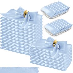 a stack of blue napkins with bows on them