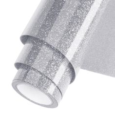 a roll of silver glitter tape on a white background