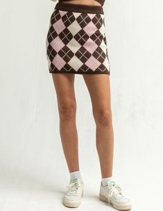 RSQ Argyle Sweater Skirt. Argyle knit skirt with ribbed trim. Approx. length: 17". 100% acrylic. Hand wash. Imported.Model is wearing a size small. Model measurements:Height: 5'9" Bust: 34"Waist: 24"Hips: 34" Trendy Fitted Knit Skirt, Trendy Knit Fitted Skirt, Casual Knit Mini Skirt, Trendy Knit Skirt For Fall, Argyle Skirt, Argyle Tights, Womens Sweater, Argyle Sweater, Knit Skirt