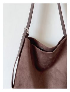 Carry your essentials in style with the Elena Handbags Soft Suede Shoulder Bag. Made of luxurious suede, this bag is both soft and durable. With its roomy interior and adjustable strap, it's perfect for everyday use. Upgrade your handbag game with Elena Handbags. Material: High Quality Suede PU Leather Size approximately 12.5"H x 12.2"W x 3.1"D Designer Style ID: 8760 Everyday Suede Shoulder Bag With Removable Pouch, Versatile Suede Shoulder Bag With Removable Pouch, Everyday Suede Bucket Bag With Soft Leather, Versatile Suede Hobo Shoulder Bag, Suede Shoulder Bag With Removable Pouch And Double Handle, Versatile Suede Hobo Bag For Daily Use, Versatile Everyday Suede Shoulder Bag, Brown Suede Shoulder Bag With Large Capacity, Versatile Suede Shoulder Bag For Everyday Use