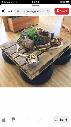 a coffee table made out of an old pallet and some other things on it