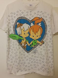 a t - shirt with two cartoon characters on it