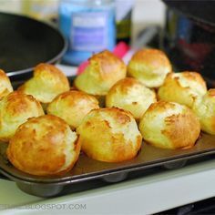 several small muffins on a baking tray ready to be baked in the oven