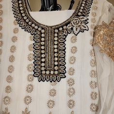 White Chiffon Maxi With Velvet Trimming, Gold Heavy Thread Work White Formal Dresses With Dupatta, Semi-stitched White Dress For Formal Occasions, White Bollywood Style Formal Dress, Festive White Embellished Kurta, White Bollywood Formal Dress, White Long Sleeve Georgette Anarkali Set, Formal White Anarkali Traditional Wear, Elegant White Embellished Kurta, Elegant White Embellished Traditional Wear